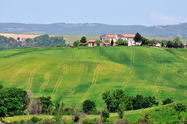 Tuscan farmhouse among the green hills