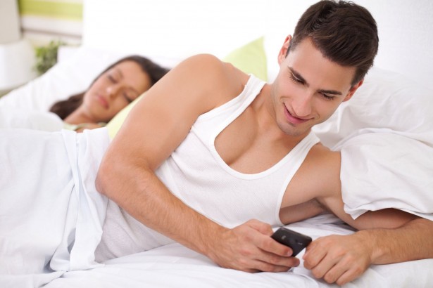 15074975 - cheating his wife, young men chatting with his mistress while his wife sleeps