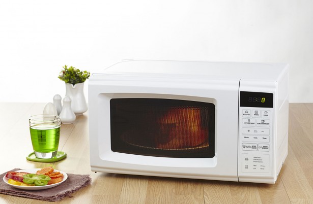 24296772 - microwave the kitchenware home appliance isolated in the kitchen interior