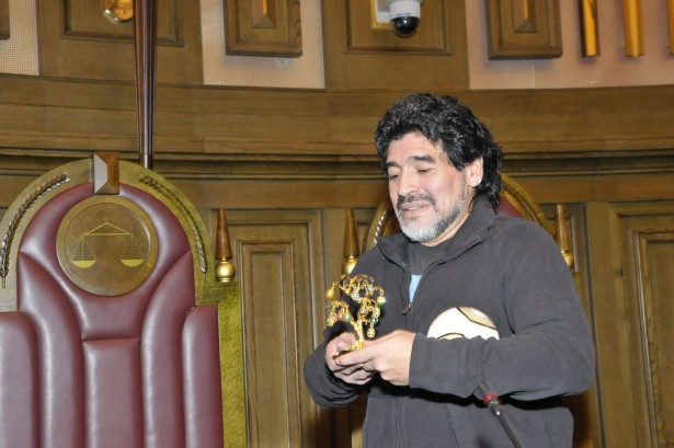 9144358 - moscow - september 30: footballer diego maradona at a friendly meeting on september, 30, 2010 in the supreme court of the russian federation, moscow, russia